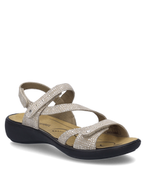 Beige sandal with Velcro closure adorned with a subtle pattern. The sandal has a black sole and provides comfortable support through the straps made of soft material.