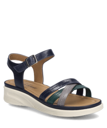 La sandalia en azul oscuro-múltiple presenta un diseño elegante con un cierre de velcro en el tobillo. Está hecha de material de alta calidad con varias correas de colores y una cómoda suela clara.