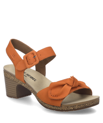 La sandale de couleur papaye est fabriquée dans un matériau lisse avec une fermeture velcro confortable. Elle se distingue par un talon stable et un nœud décoratif sur la sangle avant.