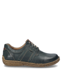 Der Halbschuh ist aus tannengrünem Leder gefertigt und besitzt eine robuste hellbraune Sohle. Besondere Merkmale sind die dekorativen Nähte und die Schnürung die für einen klassischen Look sorgt.