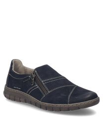 Une chaussure basse de couleur Océan avec une fermeture éclair sur le côté. La chaussure est fabriquée dans un matériau doux avec des coutures visibles et a une semelle robuste.