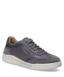 La scarpa in colore grafite è realizzata in pelle di alta qualità e presenta una elegante chiusura con lacci. La scarpa ha una suola chiara e cuciture decorative discrete che le conferiscono un aspetto classico.