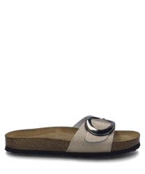 The depicted bronze sandal features a textured surface and a wide strap with a distinctive buckle as a closure. The sole is lightly padded and comes in a natural brown tone providing additional wearing comfort.