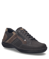 La scarpa in colore fango-combinato è realizzata in pelle di alta qualità e presenta un'istruzione di allacciatura marcata. Caratteristiche speciali sono la chiusura lampo laterale e i dettagli perforati che offrono ulteriore stile e traspirabilità.