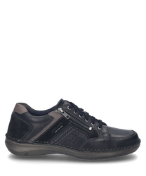 La scarpa in combinazione nera si presenta con una chiusura a lacci ed è realizzata in pelle di alta qualità. I punti decorativi laterali e la cerniera offrono ulteriore stile e funzionalità.