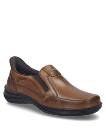 A cognac-colored leather slip-on with elastic for easy on and off. The shoe features a smooth surface and a sturdy dark sole.