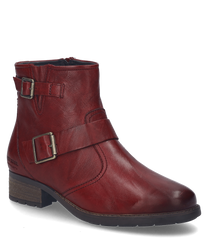 The burgundy leather ankle boot features a side zipper and decorative buckles. It has a flat heel and a sturdy sole making it ideal for everyday use.