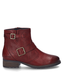 The burgundy leather ankle boot features a side zipper and decorative buckles. It has a flat heel and a sturdy sole making it ideal for everyday use.