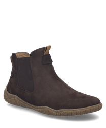 The ankle boot in the color Brazil is made of soft brown suede material with elastic inserts on the sides. It features a practical zipper for easy on and off.