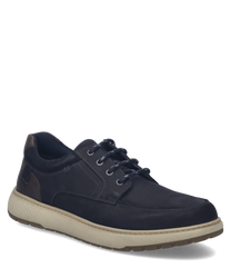 Zapatilla azul oscuro con cordones hecha de cuero suave. El zapato tiene una suela texturizada de color gris claro y detalles marrones en el talón.