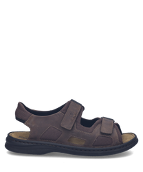 Sandales en cuir marron foncé avec fermetures Velcro. Design robuste et confortable idéal pour une utilisation quotidienne.