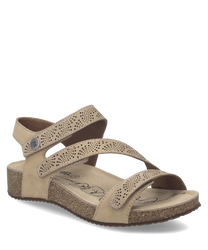 Beige sandals with Velcro straps featuring a speckled design and a cushioned cork sole. The open-toe design adds comfort and the sandals are ideal for casual wear.