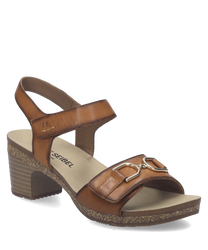 Sandales en cuir marron avec fermeture Velcro. Talon moyen et semelle texturée pour un confort optimal.