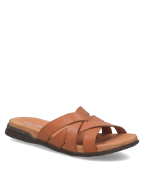 Brauner Slipper aus Leder ohne Verschluss. Der Schuh hat überkreuzte Riemen und eine flache Sohle für hohen Tragekomfort.