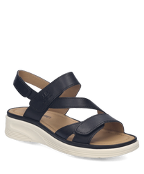 Sandales en cuir noir avec fermeture Velcro. Semelle blanche épaisse pour un confort optimal.
