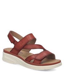 Sandalias de cuero marrón con cierre de velcro. Suela blanca de goma diseño cómodo y casual.