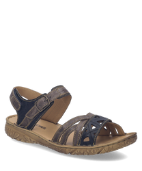 These sandals feature a brown leather material with a Velcro strap closure for easy adjustment. The sole is textured for grip and comfort making them ideal for casual wear.