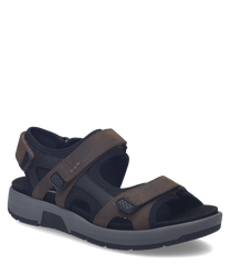 Brown sandals with Velcro straps featuring a mix of leather and synthetic materials. The sandals have a sturdy sole suitable for outdoor activities and a comfortable fit.