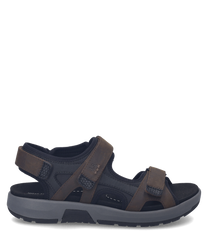 Brown sandals with Velcro straps featuring a mix of leather and synthetic materials. The sandals have a sturdy sole suitable for outdoor activities and a comfortable fit.