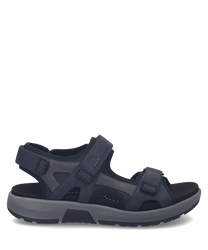Donkerblauwe sandaal met klittenbandsluiting. Het materiaal is leer met een stevige zool voor comfort.