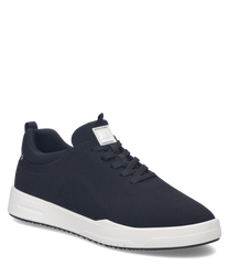 Baskets noires avec lacets et semelle blanche. Fabriquées en tissu respirant elles offrent un confort optimal pour un usage quotidien.
