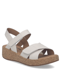 Sandalo bianco con chiusura in velcro realizzato in pelle. Suola in sughero per un comfort ottimale e un look naturale.