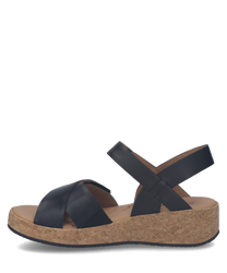 Black sandals featuring a Velcro closure with a cork sole. Made from smooth leather these sandals offer easy wear and a comfortable fit for everyday use.
