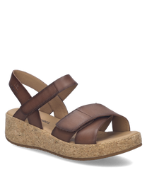 These sandals feature a brown leather upper with a Velcro closure for easy adjustment. The cork sole provides comfortable support ideal for casual wear.