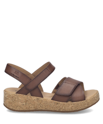 These sandals feature a brown leather upper with a Velcro closure for easy adjustment. The cork sole provides comfortable support ideal for casual wear.