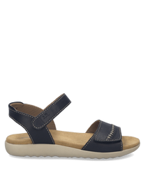 Black sandals with velcro closure and beige sole. Made of leather with visible stitching for a stylish look.