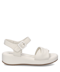 Sandalias blancas de mujer con cierre de velcro. Hechas de cuero sintético con suela plataforma para mayor comodidad.
