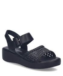 Black sandals featuring a woven strap design with a Velcro closure for easy adjustment. The sandals have a comfortable sole with a subtle platform providing both style and support.