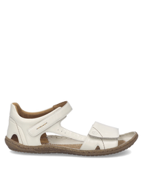 Sandalias de cuero blancas con cierre de velcro. Suela marrón y diseño cómodo para uso diario.