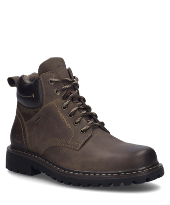 Brauner Halbschuh aus Leder mit Reißverschluss. Robustes Design mit auffälligen Nähten und griffiger Sohle für optimalen Halt.