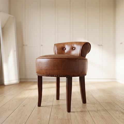 Baroque seat stool in brown leather in a dressing room