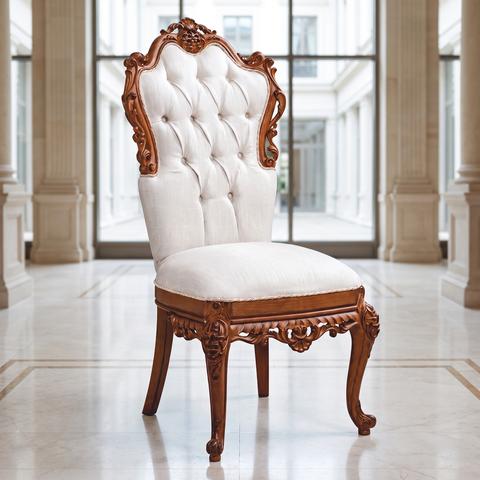 Luxury baroque hotel chair with white button tufting and walnut frame in a hotel lobby