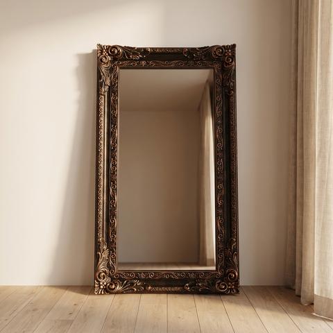 Baroque floor mirror in dark wood with gold patina