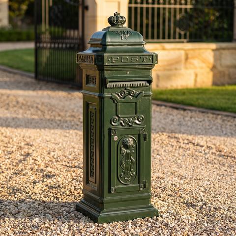 Standing Mailboxes at the garden wall of a villa driveway