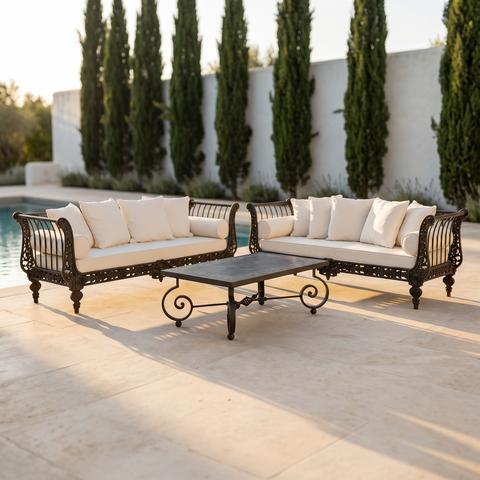 Cast iron garden furniture set with cream cushions on a pool terrace