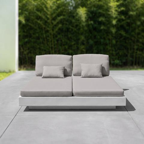 Grey garden double lounger with cushions on a terrace