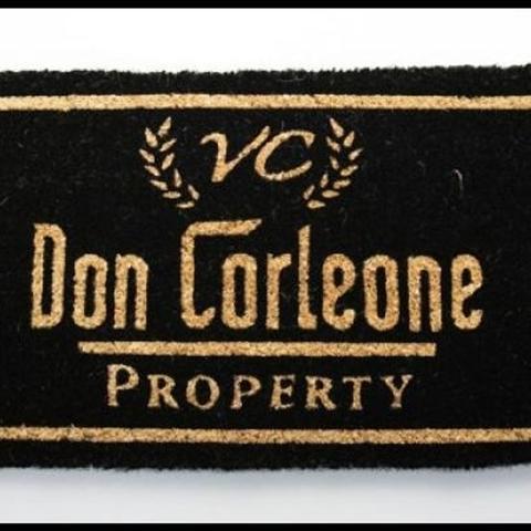 Black and gold coir door mat with lettering