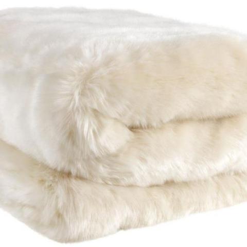 Bedspread as a cream faux fur throw