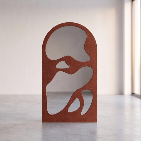 Luxury floor mirror in terracotta with organic shape