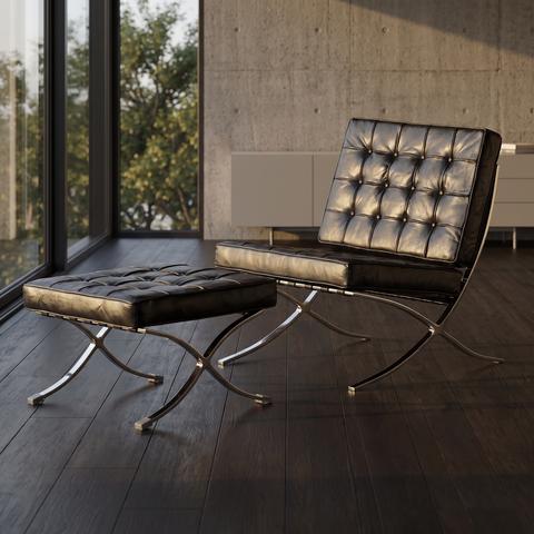 Black leather club chair with ottoman in a modern lounge