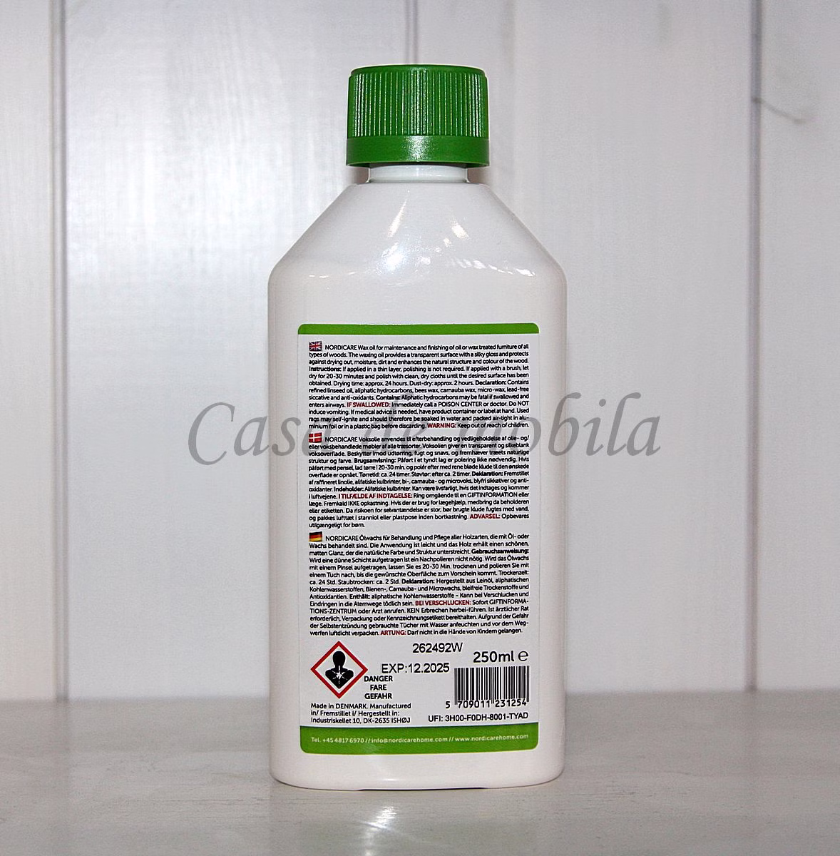 NORDICARE – Pflegeflasche Rückseite Rückseite einer weißen Pflegeflasche mit grünem Deckel und ausführlichem Anwendungsetikett.